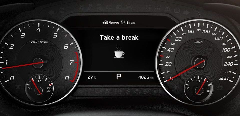Dashboard on a Kia car alerts driver to take a break